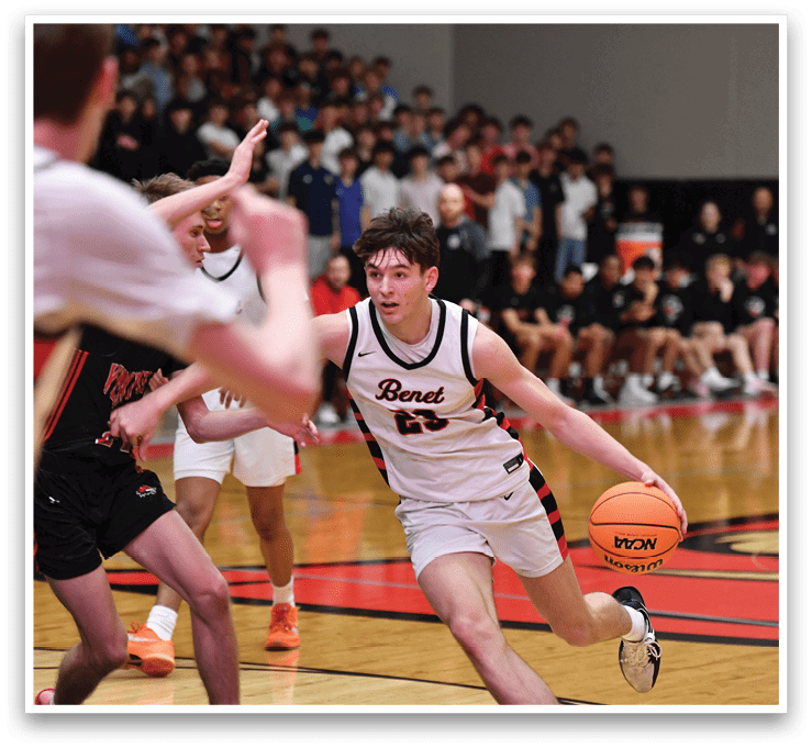 A basketball player wearing a black and white uniform is running with a basketball in his hand. AI generated content
