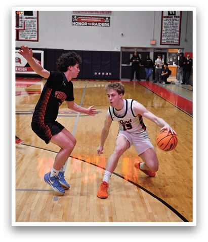 A basketball player in a black jersey is trying to block a shot by another player. AI generated content
