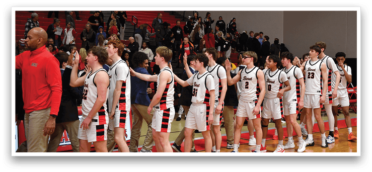 A group of young men wearing sports uniforms are lined up on a basketball court. AI generated content