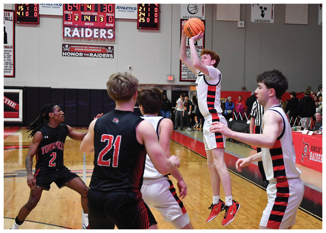 A basketball game is in progress with a player jumping to block a shot. AI generated content