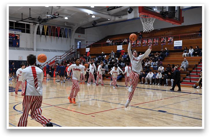 A basketball player is jumping to catch a basketball in a gym. AI generated content