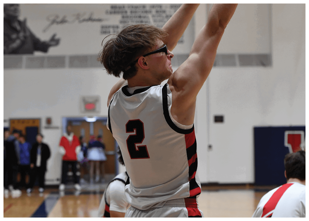 Two men playing basketball in a gym. One man is holding a remote control. AI generated content