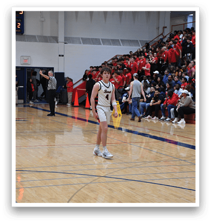 A basketball player in a white uniform stands on the court, holding a basketball. AI generated content