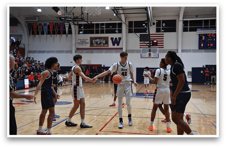 A group of young men playing basketball on a court. AI generated content