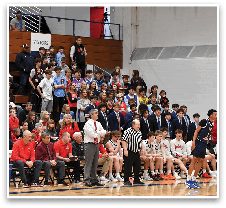 A group of people are sitting in the bleachers watching a basketball game. AI generated content