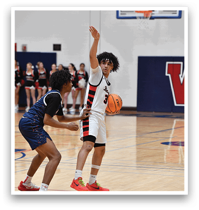 Two basketball players are on the court, one holding a basketball and the other trying to block him. AI generated content