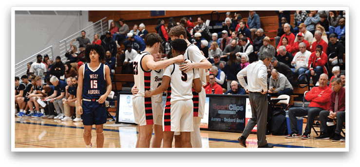 A group of men in uniforms are hugging each other on a basketball court. AI generated content