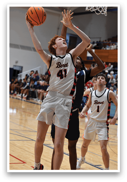 A man is jumping to catch a basketball while another man tries to block him. AI generated content