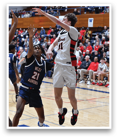 Two basketball players are fighting for the ball, with one player trying to block the other's shot. The crowd watches intently as the players compete. AI generated content