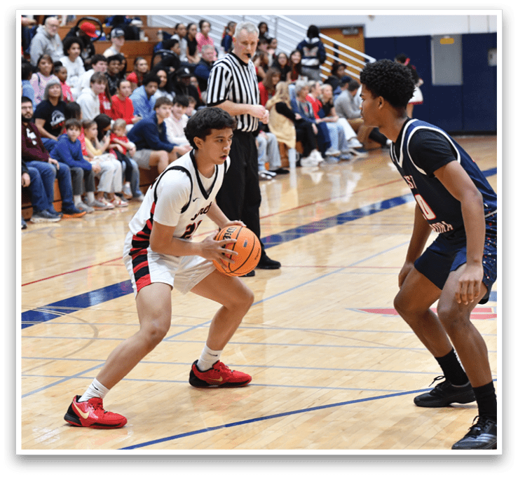 Two basketball players on the court, one with a basketball in his hand. AI generated content