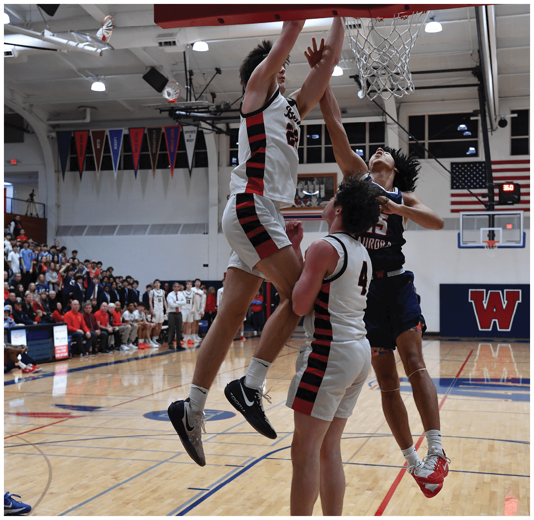 A basketball game is in progress with a player jumping for the ball. AI generated content