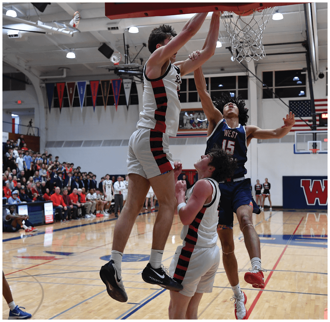 A basketball player is jumping in the air to block a shot. AI generated content