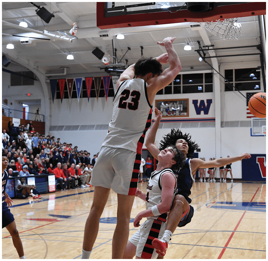 Two basketball players are fighting for the ball, with one player jumping in the air to gain possession. The crowd watches intently as the players try to score. AI generated content