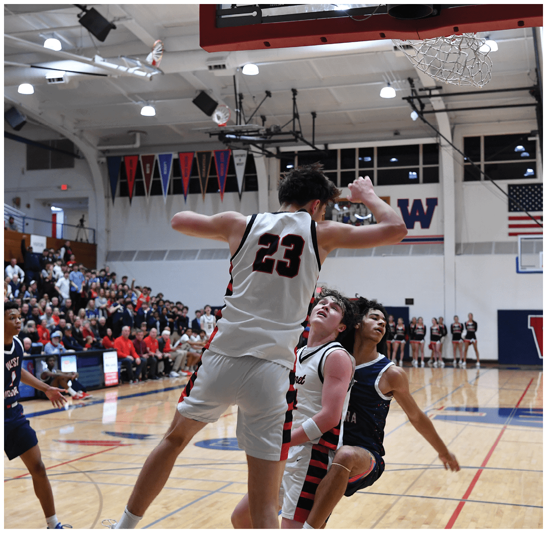 A basketball player is jumping in the air to block a shot. AI generated content