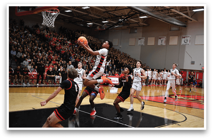 A basketball player is jumping to catch the ball in a crowded gym. AI generated content