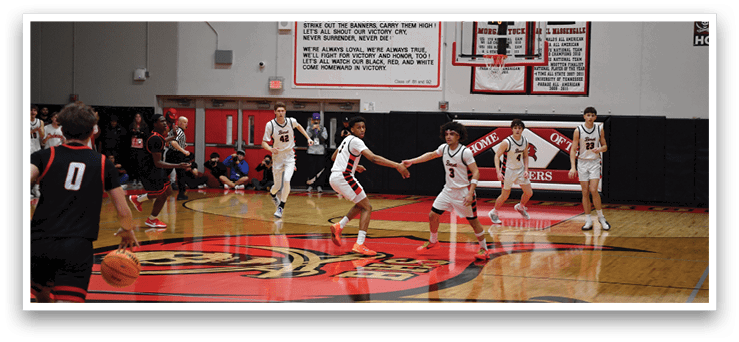 A group of young men playing basketball on a court. AI generated content