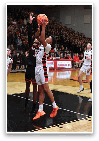 A basketball player is attempting to shoot the ball while being guarded by another player. AI generated content