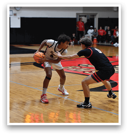 Two basketball players on the court, one trying to get the ball from the other. AI generated content