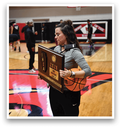 A woman holds a trophy on a basketball court. AI generated content