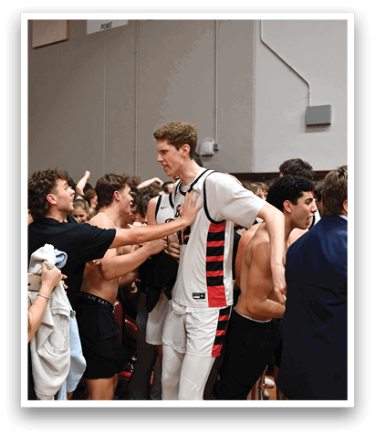 A group of people are hugging and celebrating in a gymnasium. AI generated content