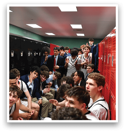 A group of young men are sitting in a locker room, wearing sports uniforms. They are talking and laughing together. AI generated content