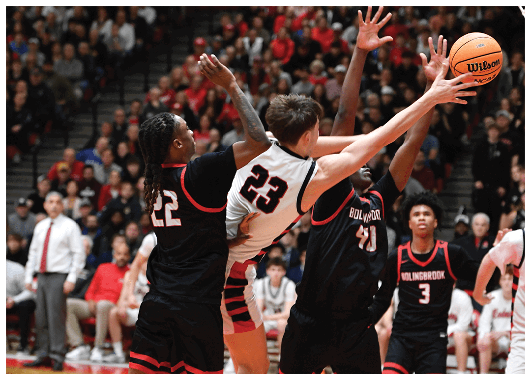 A group of basketball players are playing a game. One player is trying to block the ball from going into the basket. AI generated content