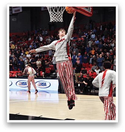 A basketball player is jumping to hit the ball. AI generated content