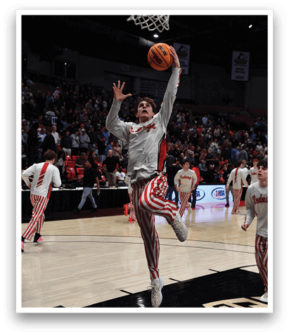 A basketball player leaps into the air to dunk the ball. AI generated content
