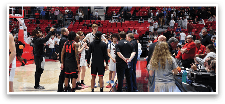 A group of people are standing on a basketball court, engaged in conversation. AI generated content