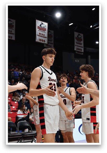 A group of men in red and white uniforms are standing on a basketball court. AI generated content