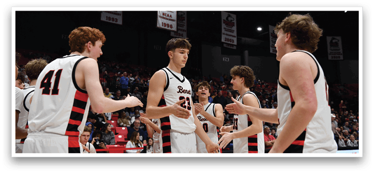 A group of men in red and white uniforms are standing on a basketball court. AI generated content