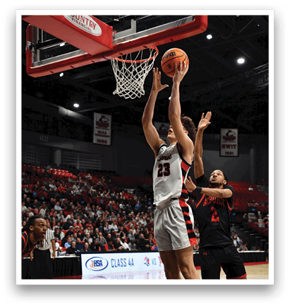 Two men are playing basketball, one is jumping to hit the ball while the other is trying to block him. AI generated content