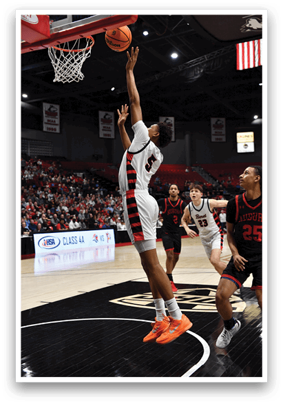 A basketball player leaps to block a shot, while the ball is in the air. AI generated content