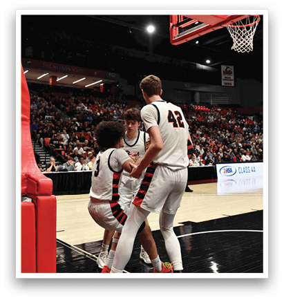 Basketball players on a court with a referee and a crowd watching. AI generated content