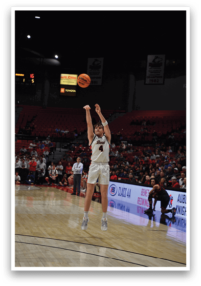 A basketball player is dribbling a ball on the court while a crowd watches. AI generated content