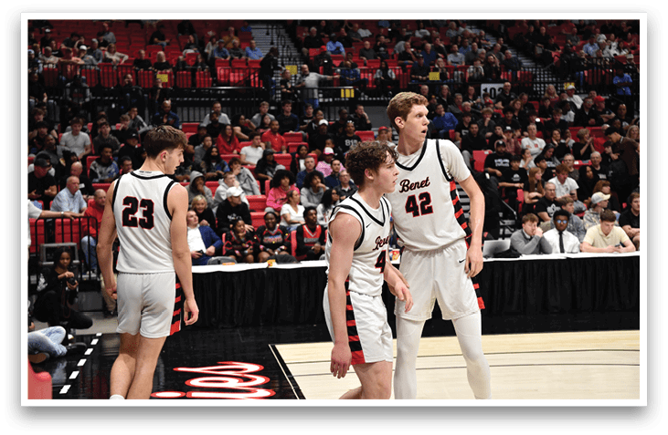 A group of men playing basketball, one of them is wearing a number 22 jersey. AI generated content