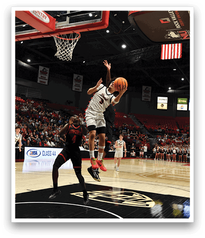 A basketball player leaps into the air to block a shot. AI generated content