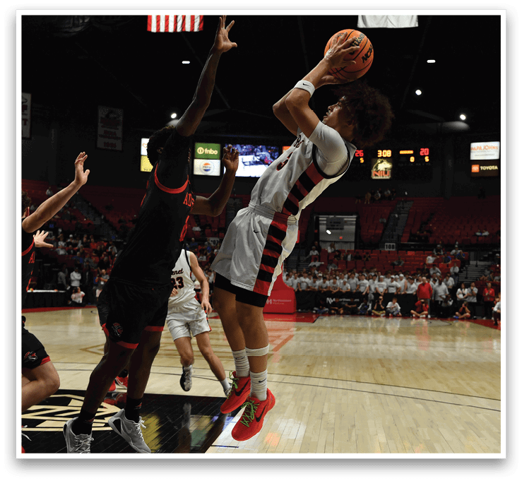 A basketball player is attempting to block a shot during a game. AI generated content