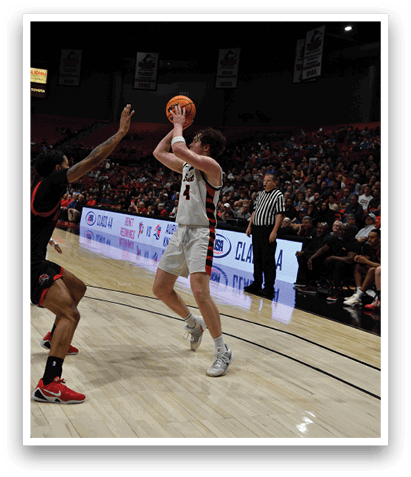 A basketball player is attempting to block a shot by another player. AI generated content
