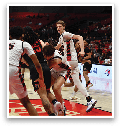 A group of men playing basketball on a court. AI generated content