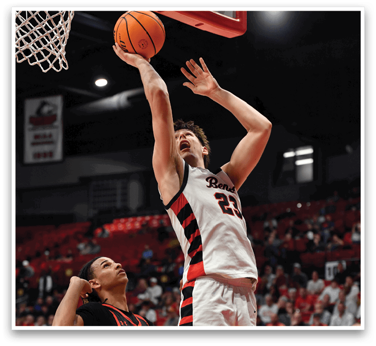 Two men are playing basketball, one is jumping to block the other's shot. AI generated content