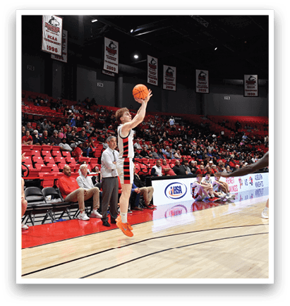 A basketball player is in the air, attempting to shoot the ball. AI generated content