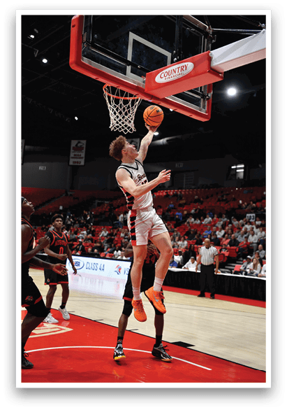 Two men are playing basketball, one of them is jumping to hit the ball. AI generated content