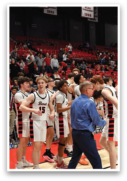 A group of men in uniforms are walking on a basketball court, with some of them holding their hands up. The crowd is watching them as they celebrate their victory. AI generated content