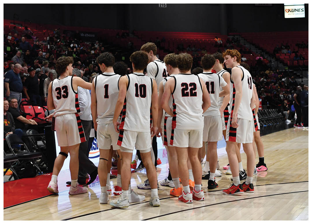 A group of young men in uniforms are standing on a basketball court. AI generated content