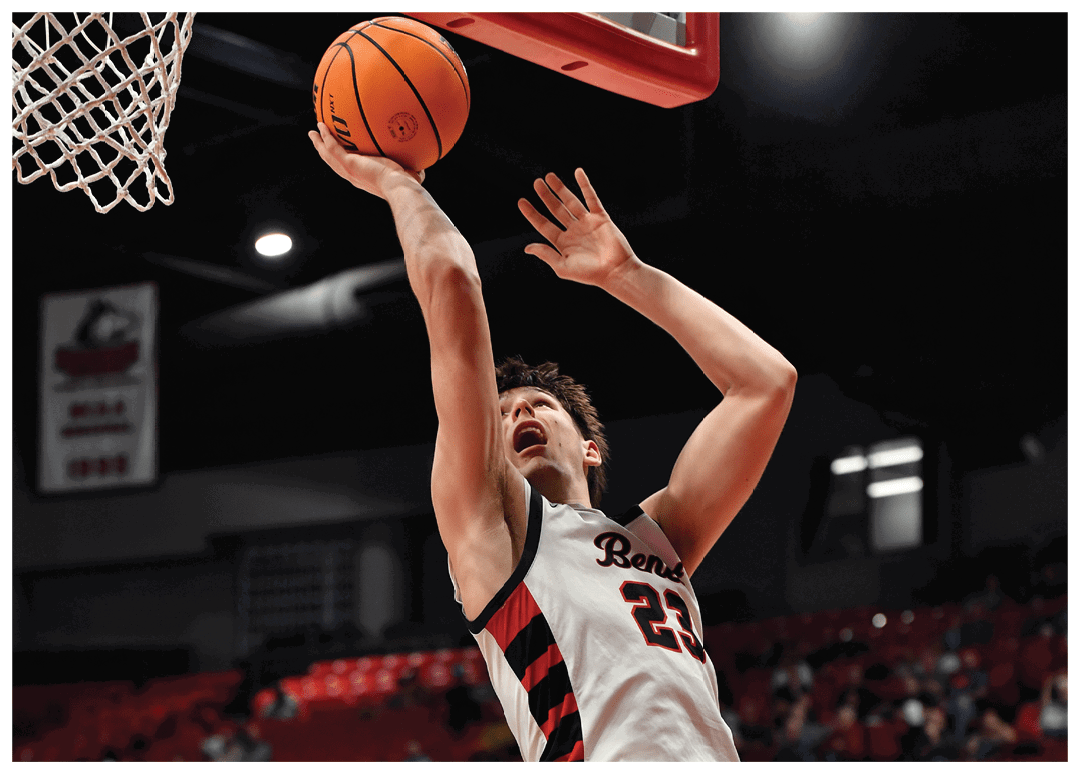 Two men are playing basketball, one is jumping to block the other's shot. AI generated content