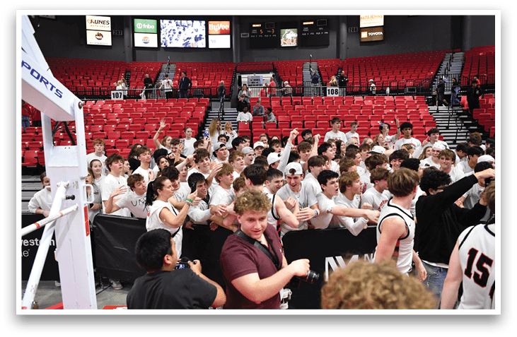 A group of people in a sports stadium, some of them wearing white shirts, are celebrating a victory. AI generated content
