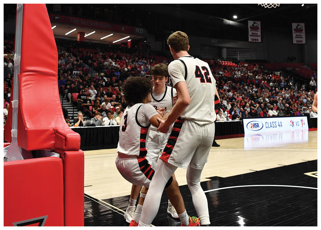 Basketball players on a court with a referee and a crowd watching. AI generated content