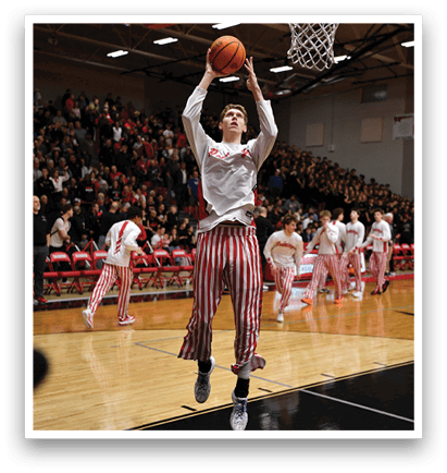 A basketball player is jumping in the air to dunk the ball. AI generated content