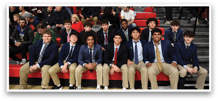 A group of young men wearing suits and ties are sitting on a bench. AI generated content